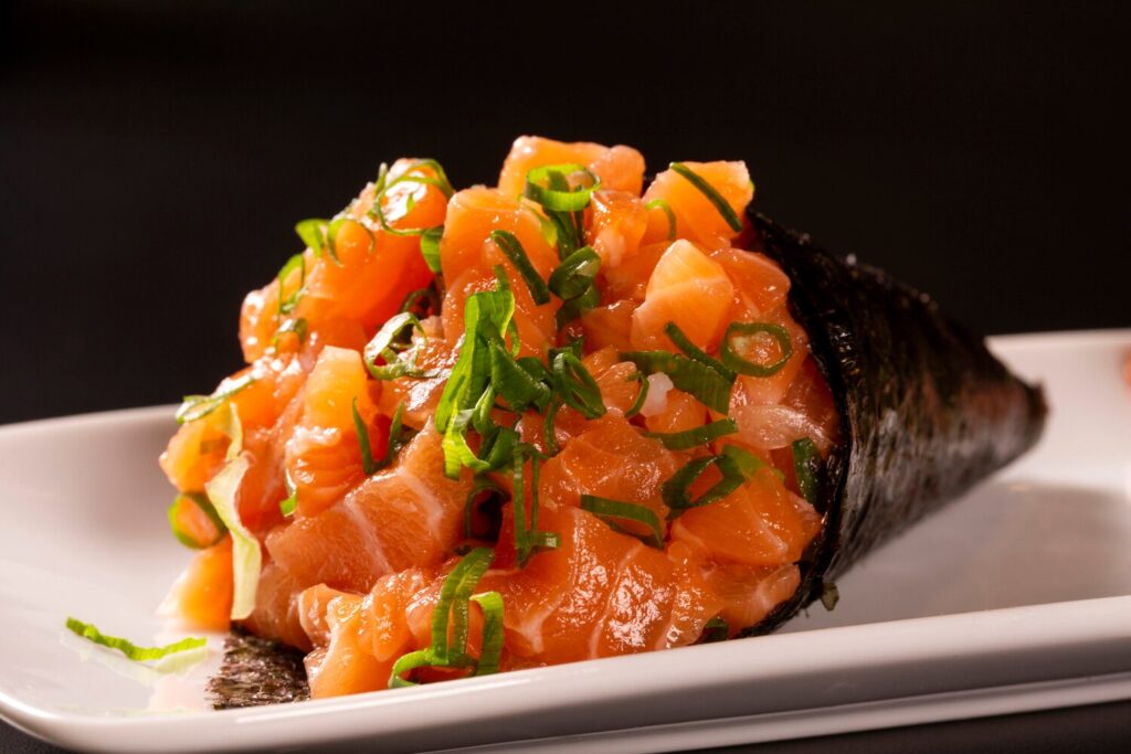 Salmon temaki sushi white plate black background 70216 746