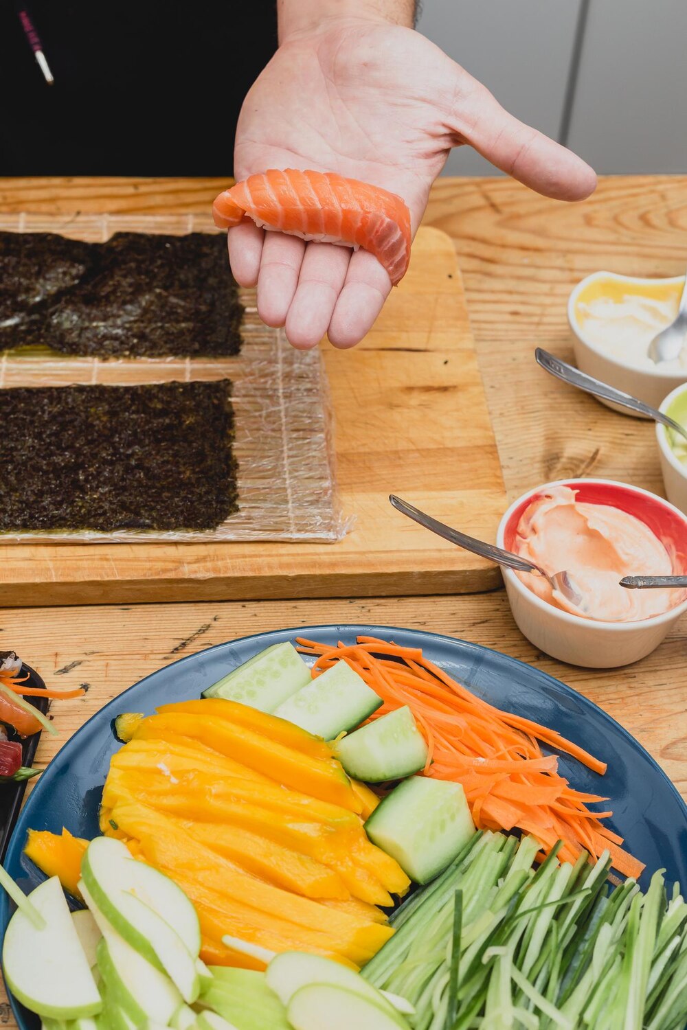 Person is reaching carrot that is being cut into pieces 115390 1274